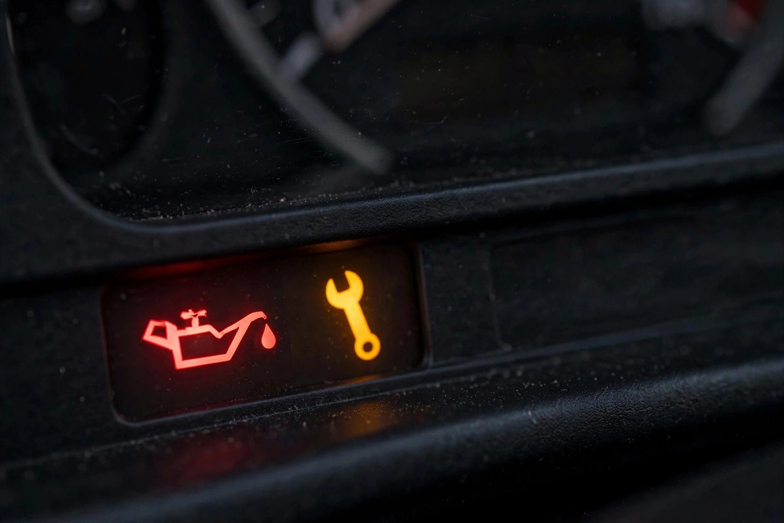 Car dashboard showing oil warning lights comparison concept